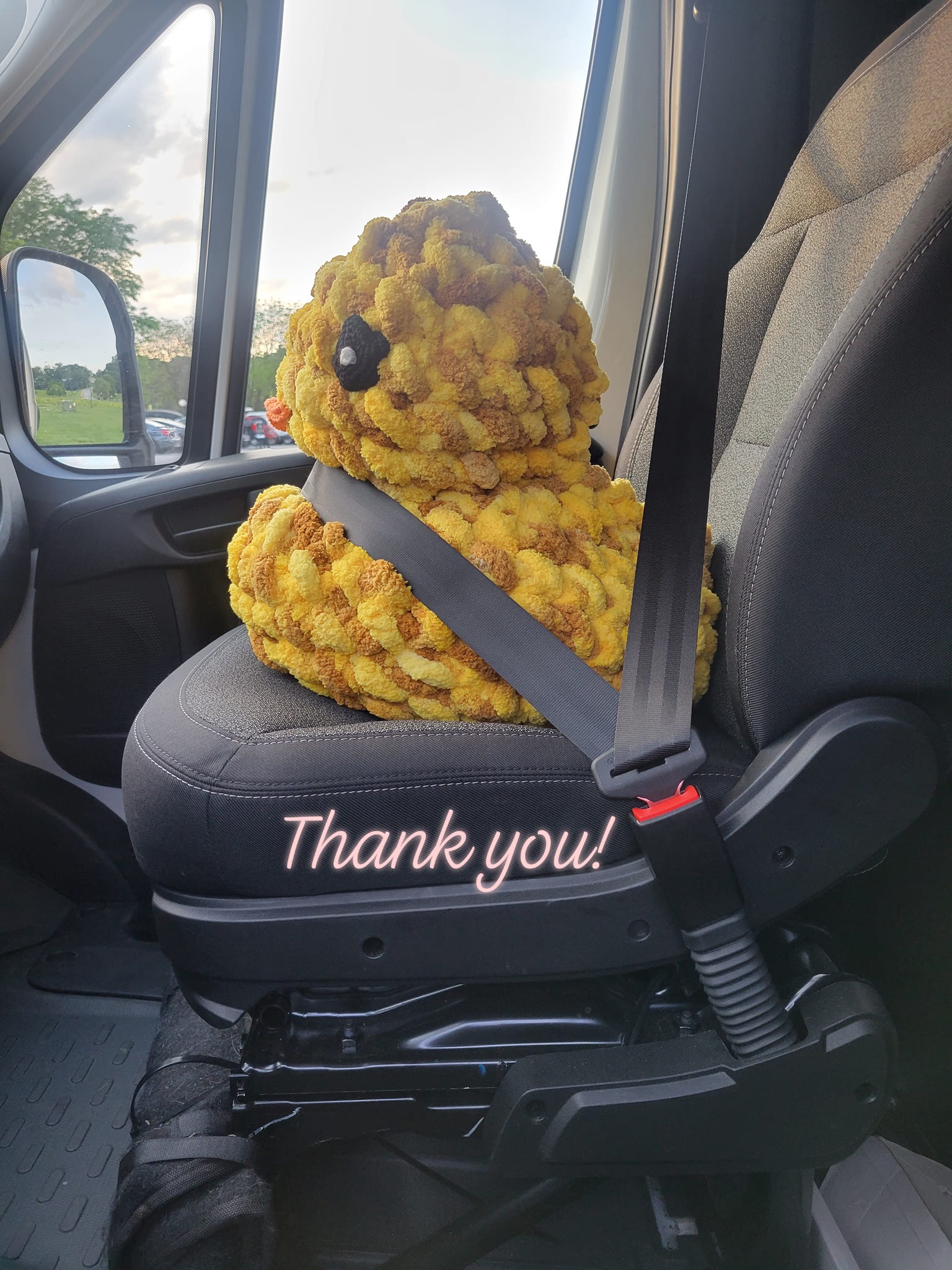 Giant Yellow Crochet Duck in moving van.jpg