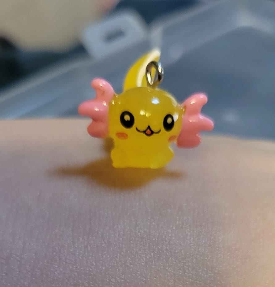 Yellow axolotl with orange fins stitch marker for crochet or knitting.jpg